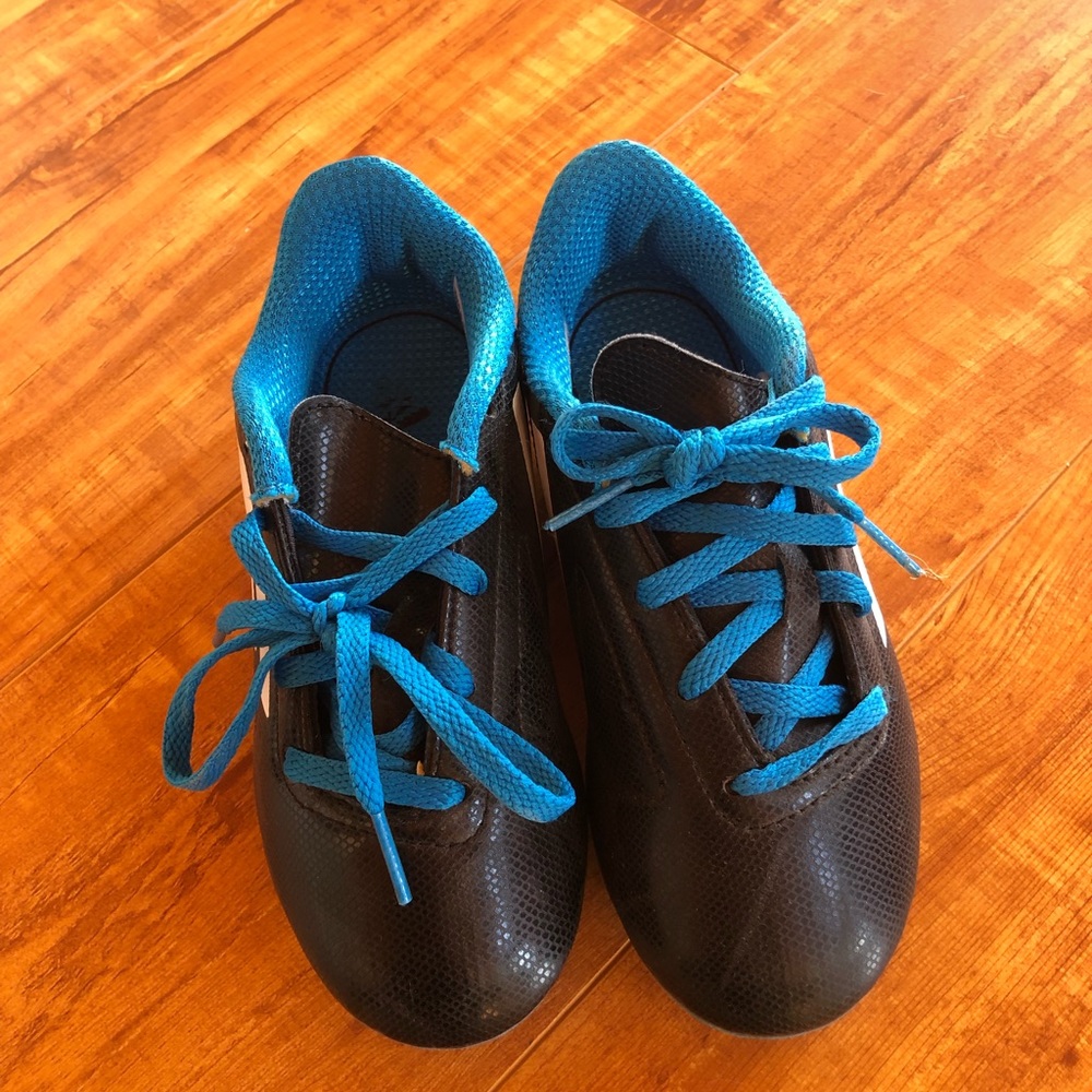 Boy’s Adidas soccer shoes.
